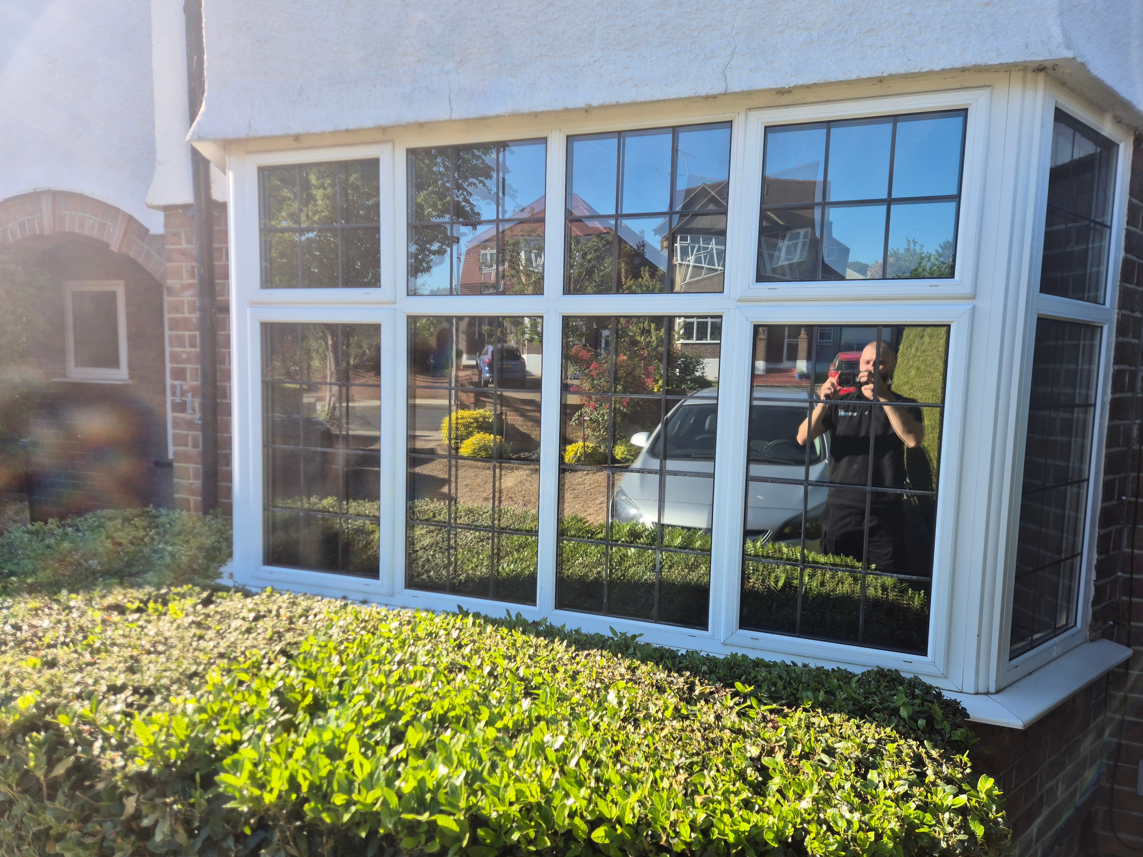 Final result of Watford bay window with a clean reflective privacy finish preventing visibility inside.