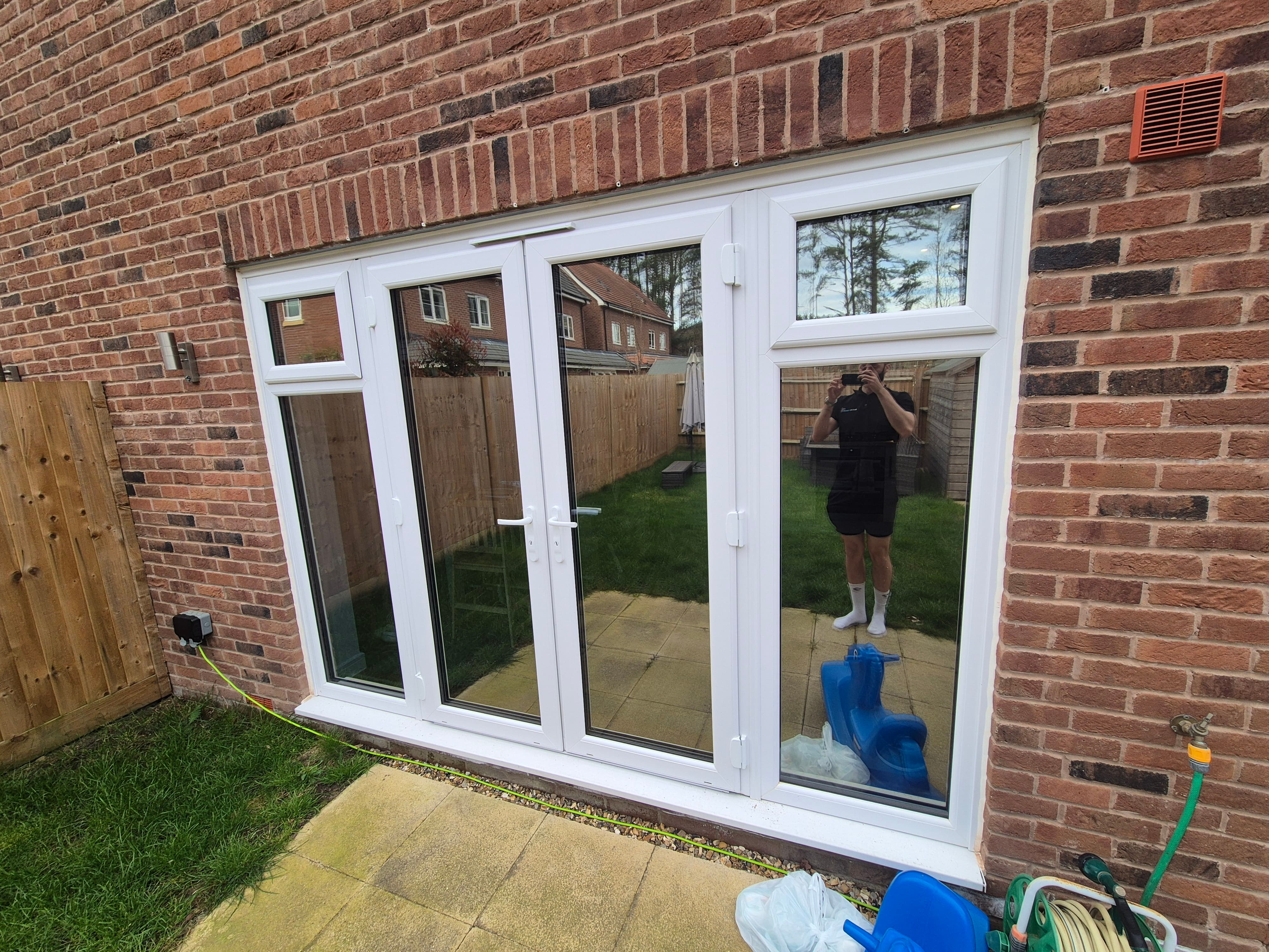 Patio doors in a Bracknell home showing a clean mirror‑like privacy finish after Silver Reflective film installation.